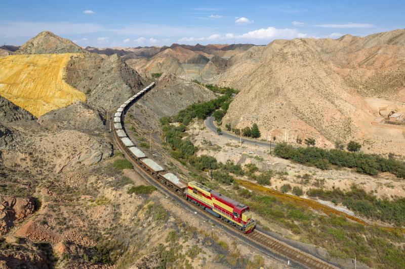 Baiyin Nonferrous Metals Corporation's DF7G 5183 hauls an ore train from the Baiyin zinc mine to the refinery. Pictured north of Baiyin, China.